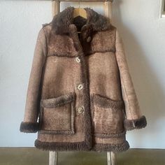 Excellent Used Condition ~ Custom-Made Authentic Leather Sheepskin Shearling Coat. This Is The Coat You Would Expect Beth On “Yellowstone” To Be Wearing! I Purchased It From A Private Seller Last Year, As We Were Planning To Move To Colorado. We Ended Up In New Mexico And I Haven’t Had An Opportunity To Wear It. It’s Too Warm To Wear Here. It Is Soft And Gorgeous With Antler Buttons. I Paid $600 My Loss, Your Gain. It’s Heavy And Warm, So If You Live Where It’s Freezing Cold, It’ll No Doubt Keep Brown Sheepskin Outerwear With Faux Fur Trim, Brown Sheepskin Fur Coat With Faux Fur Trim, Fitted Brown Shearling Fur Coat, Brown Shearling Fur Coat With Pockets, Vintage Brown Sheepskin Outerwear, Antler Buttons, Moving To Colorado, Freezing Cold, Shearling Coat