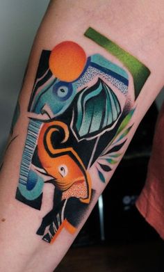 an elephant tattoo on the right arm and leg, with geometric shapes around it's head