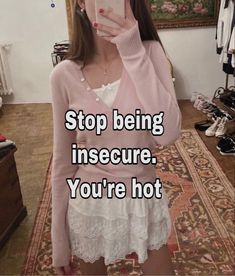 a woman taking a selfie in front of a mirror with the caption, stop being insecure you're hot