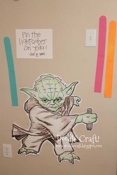 the yoda sticker is hanging on the wall