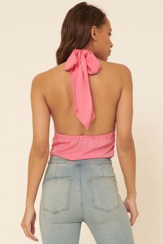 Matte-finish satin bodysuit. Crisscross halter neckline with back tie. Sleeveless. Open back. Solid knit thong bottom with snap crotch. Elastic waist. Relaxed fit. 100% Polyester. Imported. Designed in LA. Model wears size S. Backless Halter Top With Built-in Bra, Chic Pink Backless Top, Flirty Pink Halter Neck Top, Chic Pink Backless Halter Top, Stretch Satin Halter Top For Party, Party Satin Stretch Halter Top, Backless Satin Halter Top For Party, Fitted Satin Sleeveless Halter Top, Pink Stretch Halter Top With T-back