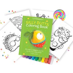 the silly butts coloring book is next to some colored pencils and a lollipop