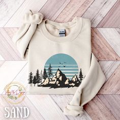 "Nature Crewneck Sweatshirt, Mountain Sweatshirt, Gift for Nature Lover, Hiking Gift, Hiking Adventure, Plus Size, Oversized Sweatshirt, Mountain Sweatshirt Retro Sunset Sweatshirt Hiking Adventure Sweatshirt Plus Size Sweatshirt Gift for Hiking and Nature Lover Gift for Her Oversized Sweatshirt Pine Tree Sweatshirt, Crewneck Sweatshirt Unisex Heavy Blend™ Crewneck Sweatshirt - Mountain Sweatshirt Ideal for any situation, Unisex heavy blend crewneck sweatshirt will keep you warm during the Fall, Autumn and winter seasons.  This sweatshirt offers the perfect blend of softness and warmth. Its plush interior ensures that you'll stay cozy and comfortable in cooler weather, making it an essential addition to your fall and winter wardrobe. Our sweaters are made to order especially for you. Becau White Cotton Sweater For Outdoor, Long Sleeve Cotton T-shirt For Hiking, Crew Neck Cotton Top For Hiking, White Long Sleeve Hiking Tops, White Long Sleeve Tops For Hiking, Crew Neck Cotton Sweater For Outdoor Activities, Crew Neck Cotton Sweater For Outdoor, White Long Sleeve Adventure T-shirt, White Long Sleeve T-shirt For Adventure