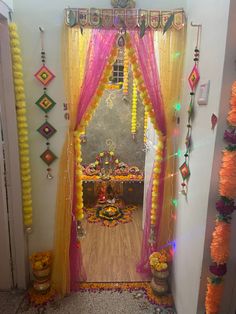 an entrance decorated with flowers and garlands