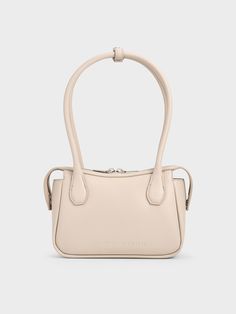 In soothing oat, this Bosie top handle bag makes a quiet statement with its distinctive shape. Featuring two elongated handles, this cute and chic piece is an updated version of the classic lady-like bag style. Equipped with a zip closure that will keep your belongings secure, it exudes a modern femininity that can be dressed up or down to suit the occasion -- it will work well for both work days and the weekends. Charles Keith, Bag Style, Handle Bag, Oats, Bag Making, Top Handle, Fashion Bags, Work Wear, Top Handle Bag