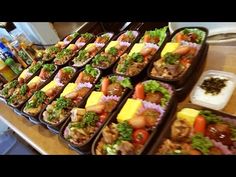 trays filled with different types of food on a table