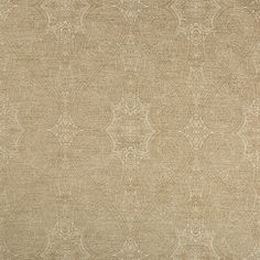 a beige rug with an intricate design on it