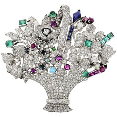 Platinum diamond basket brooch from the 1950's set with diamonds and gemstones. Diamonds weight: 4 carats approx. Gemstones: 2.50cts approx. Gemstone Brooch, Basket Of Flowers, Flower Baskets, Diamond Brooch, Art Deco Diamond, Art Deco Jewelry, Flower Basket, Jewelry Designs, Vintage Brooches