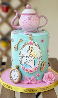 there is a cake that looks like it has a teapot on top and clock