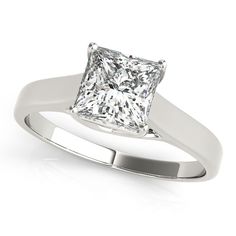 a princess cut diamond engagement ring on a white background with clipping for the center stone