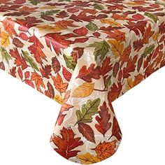 an image of a table cloth with leaves on it