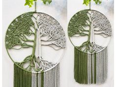 two circular metal wall hangings with trees on them