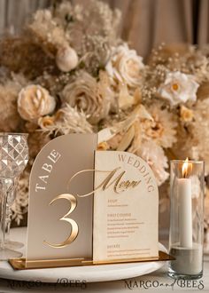 a table set up with candles and menus