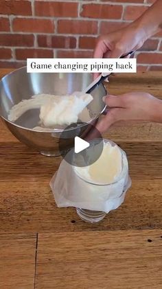 someone is mixing some food in a bowl on a wooden table with the words game changing piping hack