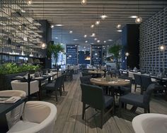 an empty restaurant with many tables and chairs