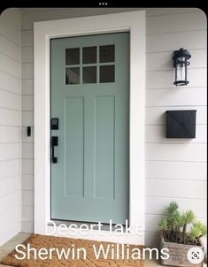 a blue front door with the words beeatt lake sherwin williams on it