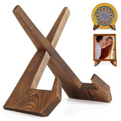 a wooden sculpture with an x on it and a picture frame next to it in the shape of a cross