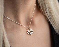 Elevate your style and spirituality with our Handmade Gold Lotus Necklace featuring a custom birthstone--a unique blend of personalized elegance and meaningful symbolism. Crafted with meticulous care, this exquisite piece is available in two exceptional materials: 925 sterling silver and 14K solid gold. Choose between the timeless allure of silver and the enduring warmth of gold, knowing that both options are of the highest quality. While the material is a significant choice, the true essence of this necklace lies in the delicate lotus pendant adorned with a custom birthstone. The lotus, a symbol of purity and enlightenment, is a captivating representation of beauty emerging from the depths. The added personal touch of a custom birthstone enhances the necklace's significance, making it a p 14k Gold Birthstone Jewelry, Rose Gold Sterling Silver Birthstone Necklace, Spiritual Rose Gold Birthstone Jewelry, Spiritual 14k Gold Birthstone Jewelry, Personalized Spiritual Yellow Gold Birthstone Necklace, Spiritual Engraved May Birthstone Jewelry, Personalized Spiritual White Gold Jewelry, Spiritual Sterling Silver Birthstone Necklace With Gemstone, Spiritual Yellow Gold Sterling Silver Birthstone Necklace