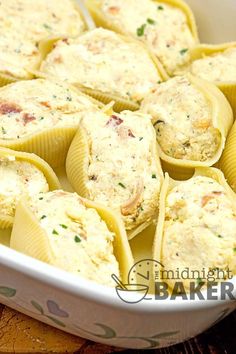 a casserole dish filled with chicken and cheese