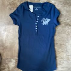 Brand New Casual Blue T-shirt With Buttons, Navy Casual Tops With Button Closure, Casual Navy Tops With Button Closure, Poshmark Clothes, Fire Shoes, Aeropostale Shirt, Movie Ideas, Aeropostale Shirts, Sublimation Ideas