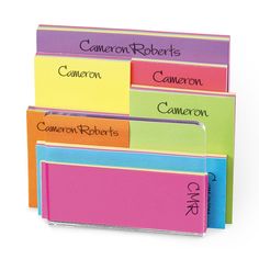 four different colored folders with the names of each subject on them, all stacked together