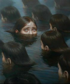 a group of people in the water with their heads submerged