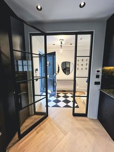 an empty room with black and white checkered flooring