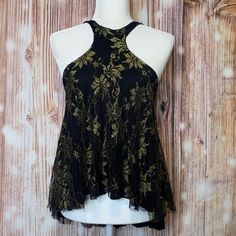 New With Tags! Black And Gold Colors Mettalic Accents Halter Sleeveless Tank Cut Outs On The Back Floral Design Lace/Mesh Material Lined Sleeveless Button Closure On The Back Replacement Buttons Included Perfect For Spring And Summer! Size Xs Measurements: Front Length-25" Back Length-30" Pit To Pit-19" Tags: Mettalic, Lace, Mesh, Womens, Festival, Beach, Travel, Breathable, Lightweight, Halter, Summer, Spring, Layering, Free People,Gold Metallic Sleeveless Spring Top, Metallic Sleeveless Top For Spring, Gold Sleeveless Camisole For Night Out, Metallic Sleeveless Tank Top For Night Out, Gold Stretch Tank Top For Night Out, Stretch Gold Tank Top For Night Out, Gold Sleeveless Summer Vest, Gold Sleeveless Vest For Summer, Gold Cami Tank Top For Night Out