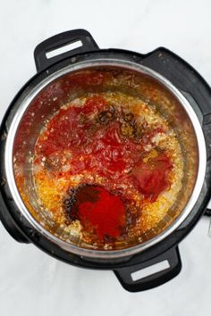 an overhead view of a pot filled with food