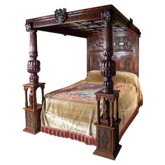 an ornate wooden bed frame with intricate carvings