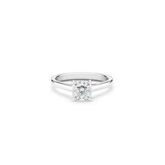 a white diamond ring on a white background