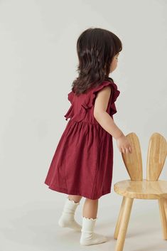 Our new baby girl dresses are made with GOTS-certified organic cotton with ruffles at the front, sleeveless and flared skirts. A small opening at the back of the neck with a button for easy pulling on. (6-12M, 12-18M, and 18-24M come with snaps buttons on the inner lining for covering) -Made of: 100% GOTS-Certified Organic Cotton -Color: Wine Red Sleeveless Ruffled Twirl Dress For Playdate, Sleeveless Cotton Ruffle Dress, Casual Cotton Ruffle Twirl Dress, Casual Cotton Twirl Dress With Ruffles, Sleeveless Cotton Ruffle Dress With Ruffle Hem, Cotton Flutter Sleeve Dress For Playdate, Cotton Twirl Dress With Flutter Sleeves And Ruffles, Casual Red Sleeveless Dress With Ruffles, Cute Cotton Sleeveless Dress With Ruffles