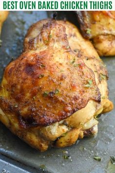 baked chicken thighs on a baking sheet with text overlay that reads best oven baked chicken thighs