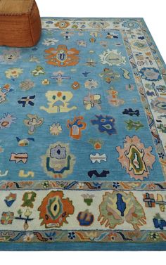 a blue rug with many different designs on it