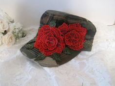 I designed this camouflage distressed military cadet hat with a gorgeous red flower embroidered applique. I added beautiful rhinestone accents to the center. This hat is so pretty. Perfect for those bad hair days or just for fun. Love this hat.... Has a velcro pony tail back. See more of my cadets, baseball caps and truckers hats here: https://www.etsy.com/shop/theraggedyrose?ref=seller-platform-mcnav&section_id=10557807 Golf sun visors here: https://www.etsy.com/shop/theraggedyrose?ref=seller-p Adjustable Camouflage Hat For Spring, Truckers Hats, Military Style Hat For Sports On Memorial Day, Cadet Hats, Military Hats For Memorial Day Sports, Military Style Camouflage Trucker Hat For Sports, Military Camouflage Hat With Curved Brim, Cadet Hat, Military Camouflage Baseball Cap