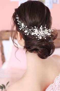 a woman wearing a bridal hair comb