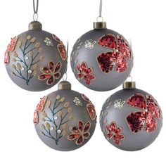 three ornaments with red and gold designs on them