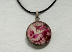 Why not treat yourself or a friend to this one-of-a-kind, wearable art, magenta, pink, white floral abstract pendant necklace. The design looks like a flower garden.  Perfect gift for Valentine's Day, birthdays, Mother's Day, anniversary, bridesmaid's gifts, teacher appreciation gift, BFFs, Bat Mitzvah or "just because".  Materials The pendant's design is made from acrylic pour paint and comes with a high-quality 24 inch black cotton waxed cord necklace with a metal clasp and extension chain (nickel-free).  The necklace comes with a sheer organza mesh jewelry bag with drawstring for gift giving and safe keeping. The round transparent glass cabochon is backed by a lightweight stainless steel tray and measures 25mm / 1 inch in diameter.  Photos were taken with a cell phone. The colors that y Pink Adjustable Flower Pendant Necklace, Hand Painted Pink Flower Jewelry, Artistic Pink Flower Jewelry, Pink Hand Painted Flower Jewelry, Pink Wearable Art Jewelry As Gift, Pink Wearable Art Jewelry For Gift, Adjustable White Hand Painted Necklaces, Adjustable White Hand Painted Necklace, Artistic Nickel-free Pink Jewelry