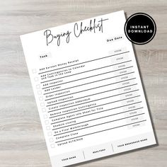 the printable wedding checklist is on top of a wooden table with a black and white