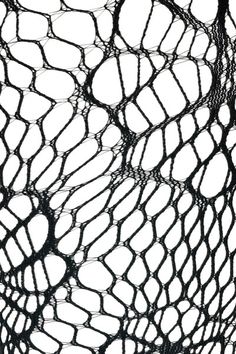 an abstract black and white photo of netting