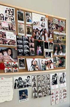 a bulletin board with many pictures on it next to a wall covered in magnets