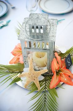 a starfish is sitting on top of a table with flowers and other items around it