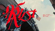 an image of the word riot written in red on top of a building with american flags