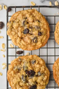 oatmeal raisin chocolate chip cookies cooling on a wire rack with nuts