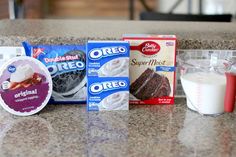 the ingredients for an oreo cake are sitting on the kitchen counter next to each other