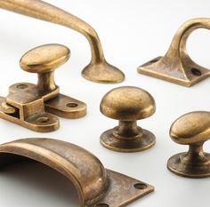 an assortment of antique brass door handles and knobs