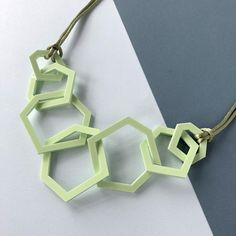 Contemporary pistachio green mid-century geometric link necklace which is perfect for the woman who likes modern jewellery. My necklaces are light and easy to wear and will give your favourite outfit an istant pop of colour. This seven link necklace is my 'between' size, not as dramatic as my twelve link necklace and more of a statement than the three link one. It is mid-length and measures 26 inches long and hangs 13.5 inches from the clasp to the bottom link.  Three sizes of laser cut geometri