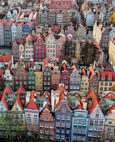 an aerial view of many colorful houses in the city