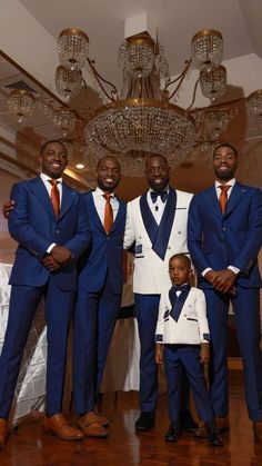 a group of men in suits standing next to each other