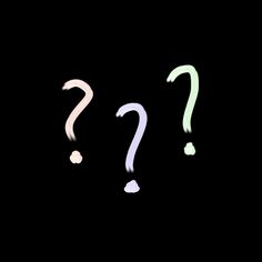 two different colored question marks on a black background